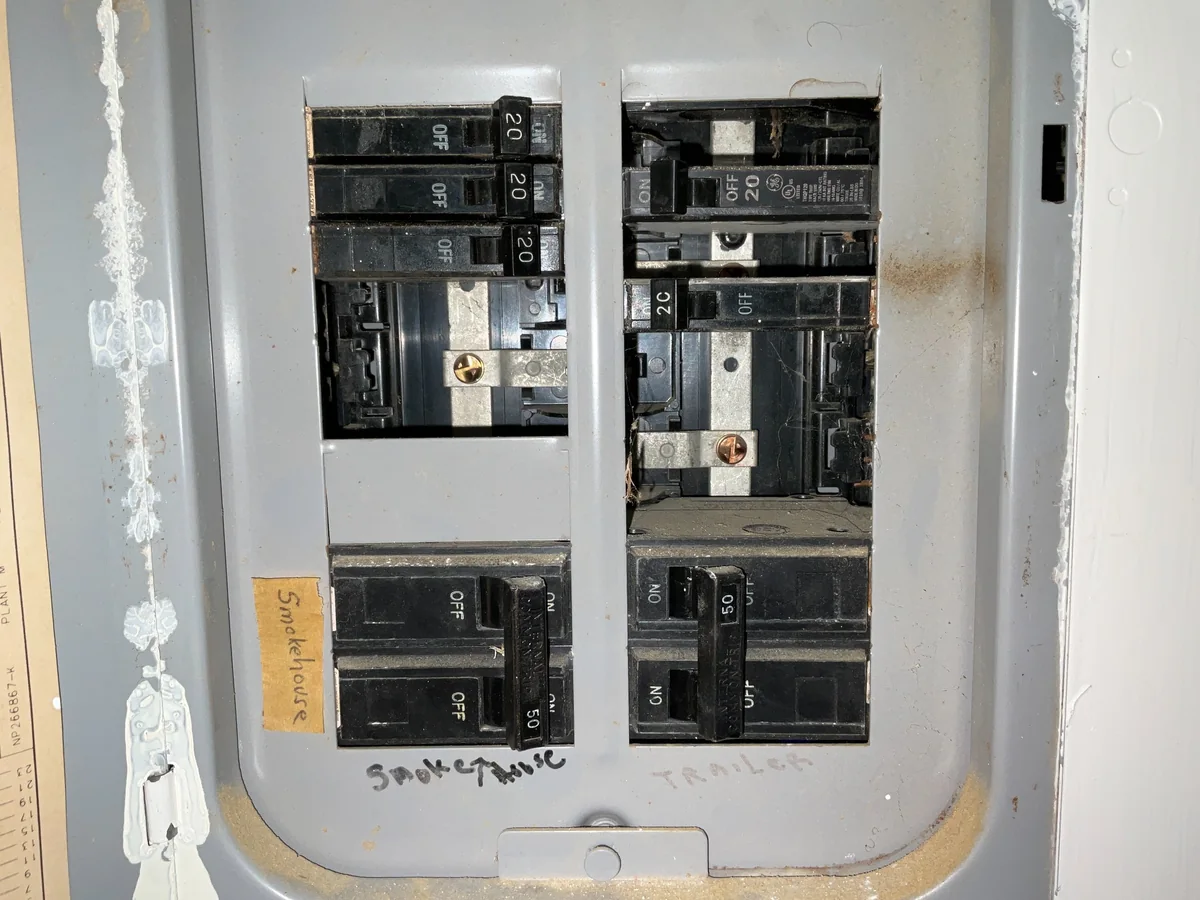 Open breaker spaces in an electrical panel cover
